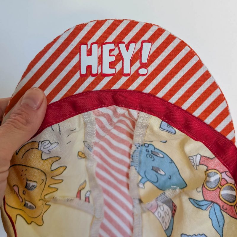 retro comic cycling cap hey